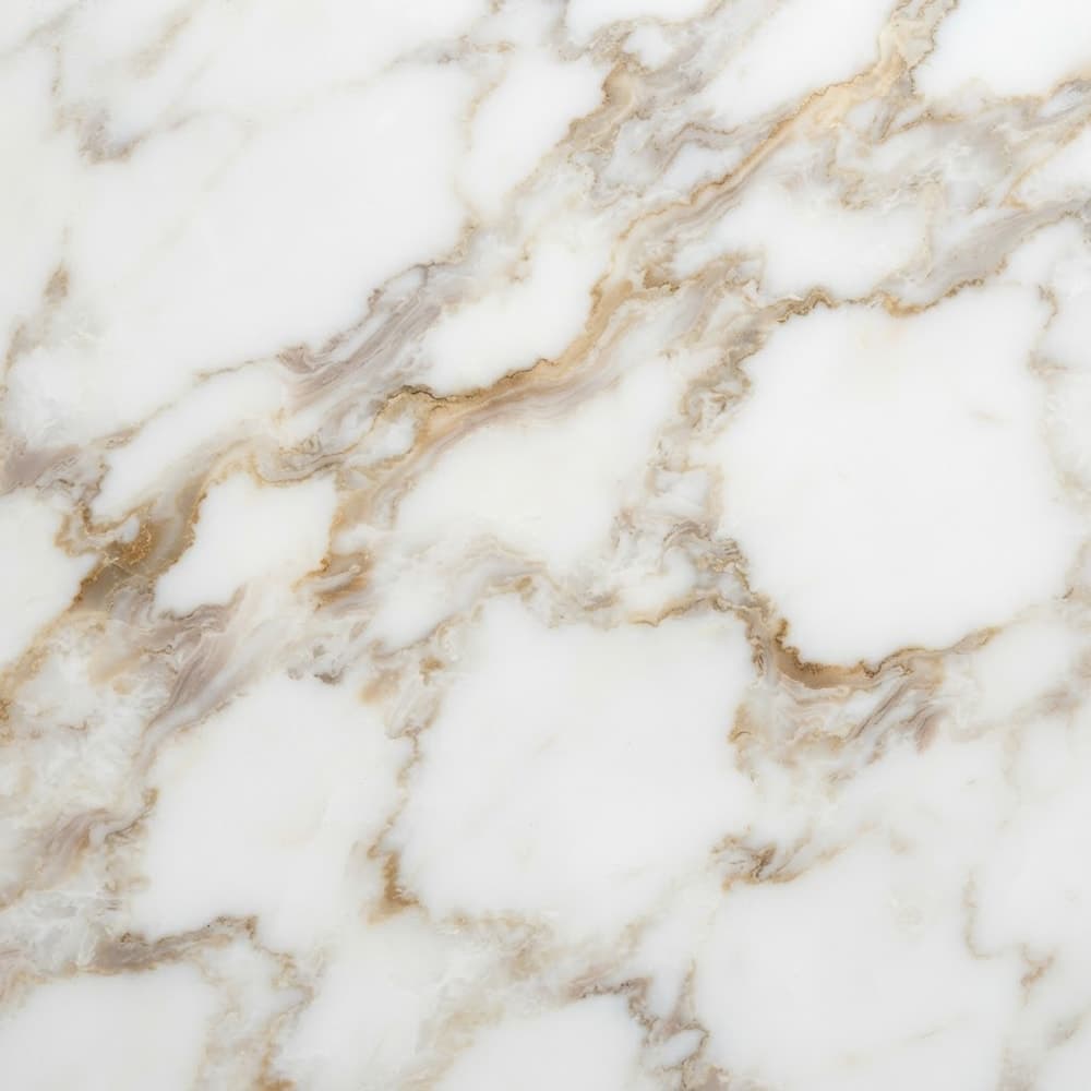 Поверхня каменю: Мармур Calacatta Oro
